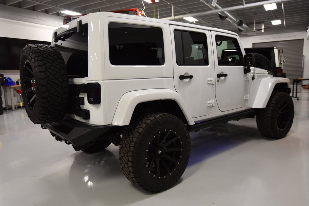 Jeep JK Wrangler with lift kit and aftermarket wheels